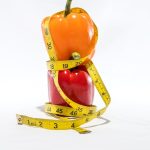 a measuring tape wrapped around a bell pepper